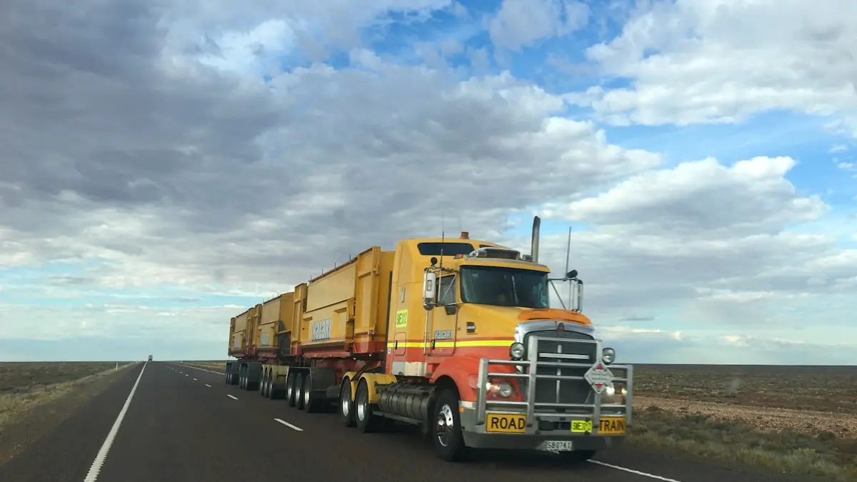 A semi truck travelling on a highway in daylight