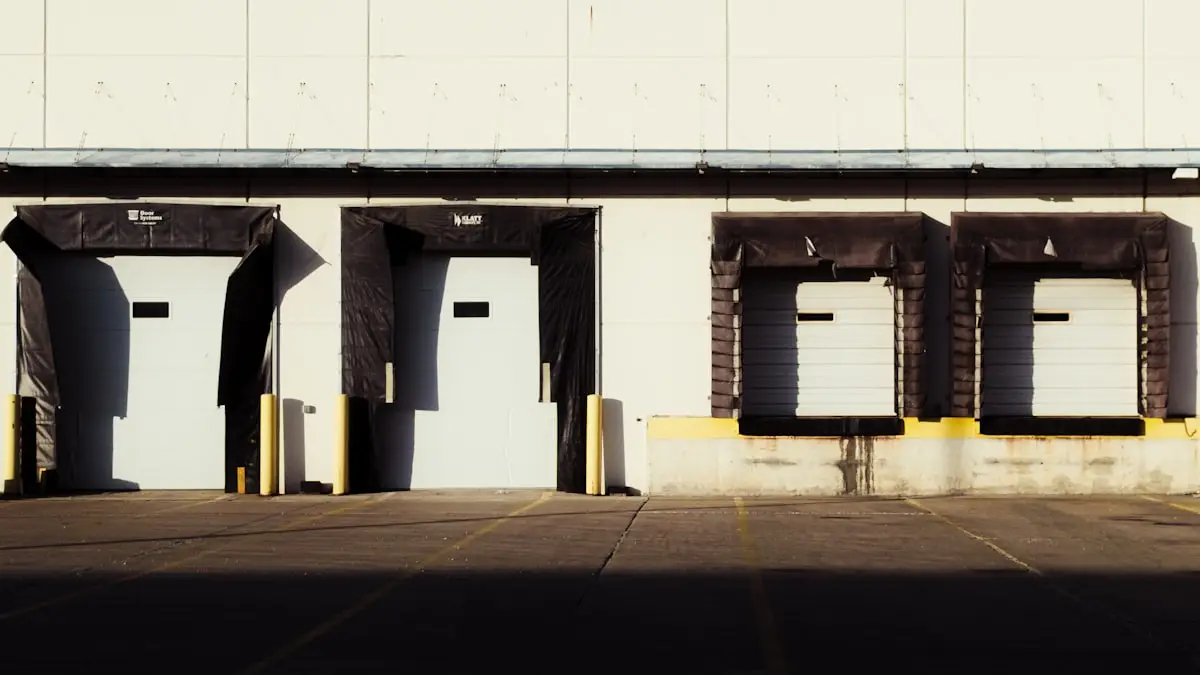 A row of empty loading dock doors on a warehouse
