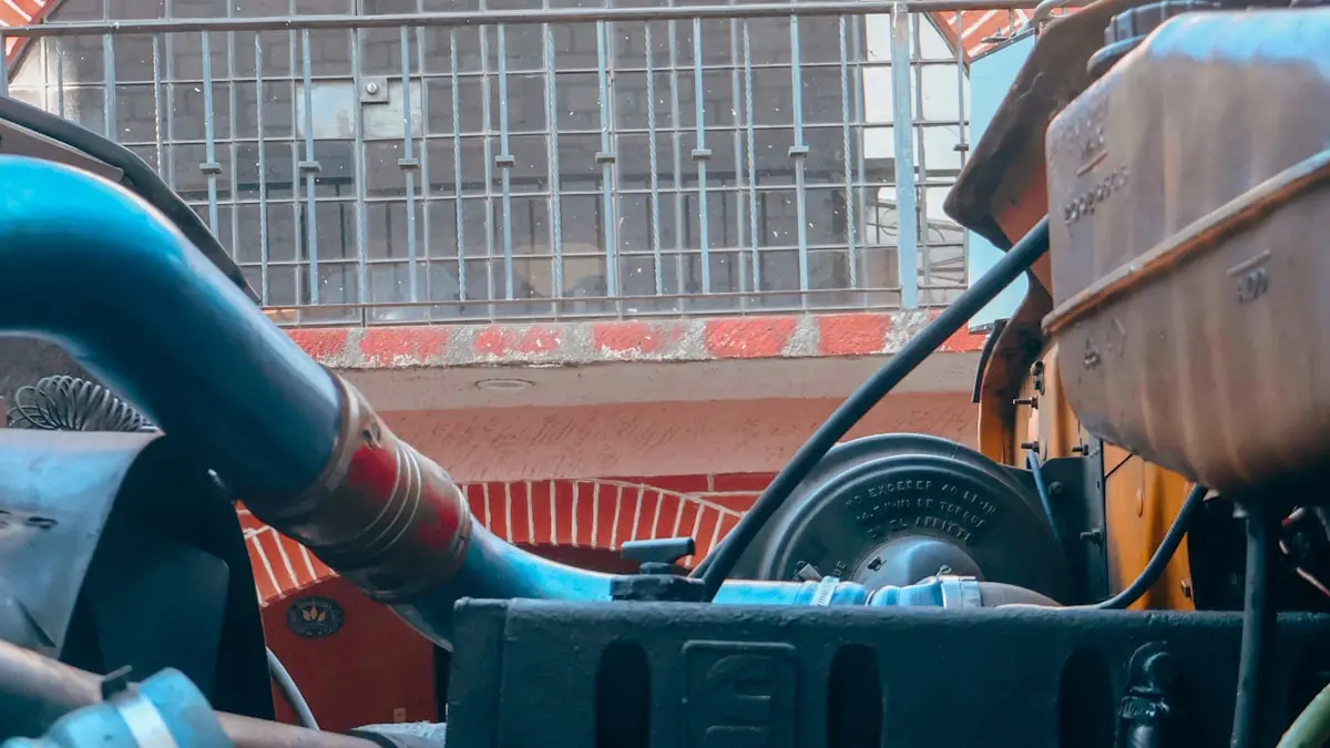 Close-up of a truck engine bay showing hoses and components