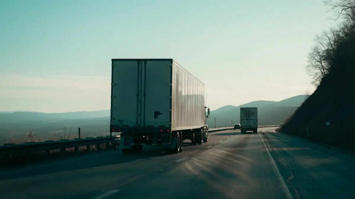 Two semi trucks travelling together on an open highway